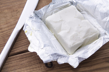 butter block on wooden board. Baking or cooking concept