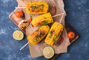 Grilled corn cobs  with garlic and pepper