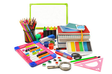 Assortment of school and office supplies isolated on white background.