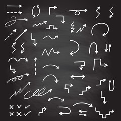 Hand drawn arrow set isolated on blackboard texture with chalk rubbed background. Doodle arrows sketch. Vector illustration.