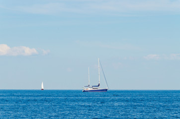 Naklejka na ściany i meble Seascape with white yacht on the sea in Odesa
