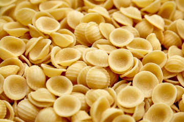 Dry Uncooked Orecchiette Italian Pasta . Food Background