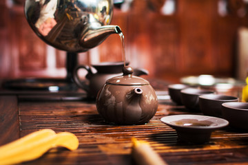 Woman traditionally preparing Chinese tea in a Tea ceremony