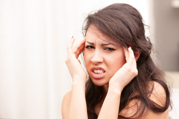Fototapeta premium woman suffering a bad headache
