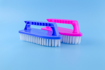 Plastic Scrub Brush on a blue background 