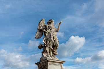 Statue with blue sky and fluffy cloud background