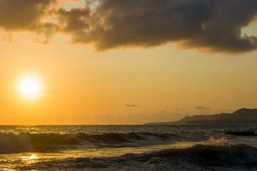 Amazing sea sunset, the sun, waves, clouds