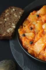 Vegetarian ragout of summer vegetables (zucchini, carrots, tomatoes, spices, garlic)