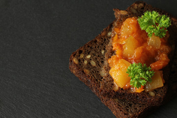 Canapes from a vegetarian ragout (stew) on a piece of bread