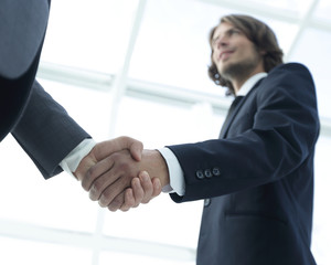 Businessmen making handshake - business etiquette, congratulatio