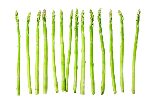 Fresh raw sprouts of green asparagus isolated on white background. Top view