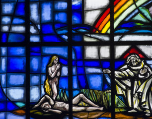 Creation of Eve in stained glass