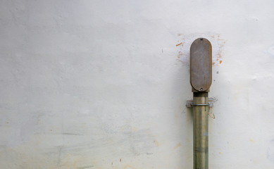 electric pipe on brick wall background. space for text