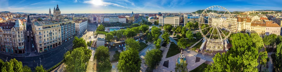 Poster Budapest, Hungary - Aerial panoramic view of Elisabeth square (Erzsebet ter) at sunrise. This view includes St.Stephen's Basilica, Deak Square, Parliament, Buda Castle Royal Palace, Statue of Liberty © zgphotography