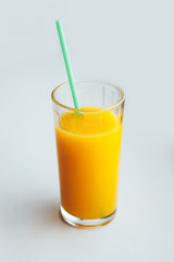 Glass of orange juice on a white background.
