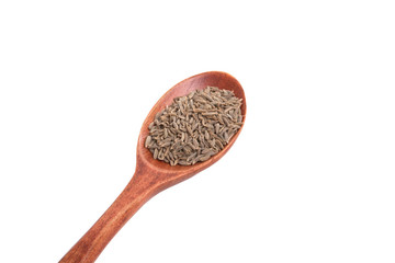 dry zira seeds spice in the spoon isolated on the white