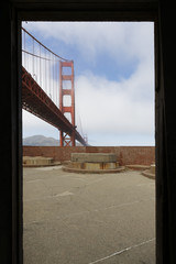 Cloudy midday in Golden Gate Bridge, seen from above of Fort Point. The Golden Gate Bridge is a famous suspension bridge connecting the American city of San Francisco, California to Marin County.