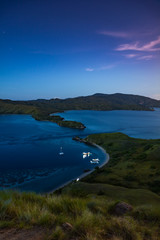 An Early Morning View Before Sunrise At Gili Lawa with Clear Sky and Tourist Boats. Komodo National Park, Labuan Bajo, Flores, Indonesia © Pnnchen
