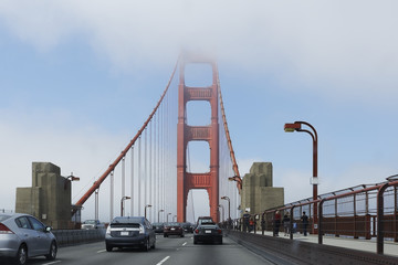 View of the tower of the Golden Gate Bridge, with Art Deco elements. The Golden Gate Bridge is a famous suspension bridge connecting the American city of San Francisco, California to Marin County.