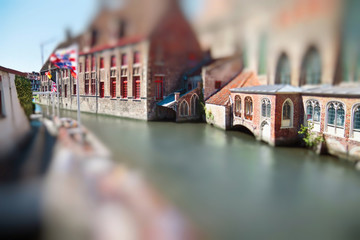 Medieval buildings and beautiful canal in the old town of Bruges, Belgium. Miniature tilt shift...