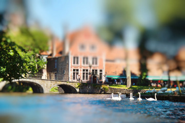 Medieval buildings and beautiful canal in the old town of Bruges, Belgium. Miniature tilt shift...