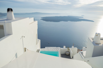 Obraz premium Whitewashed Houses on Cliffs with Sea View and Pool in Imerovigli, Santorini, Cyclades, Greece