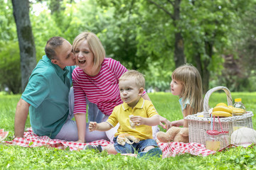 Happy family on a picnic in the park