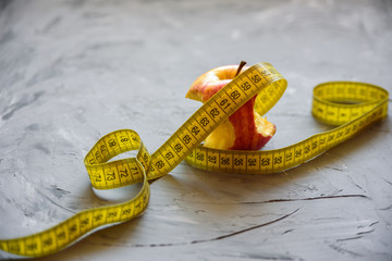 apple and measuring tape
