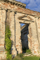 Fototapeta na wymiar Ruins of 18th century classical palace, manor complex at sunset, situated on the Nida River near Jedrzejow, Sobkow, Poland