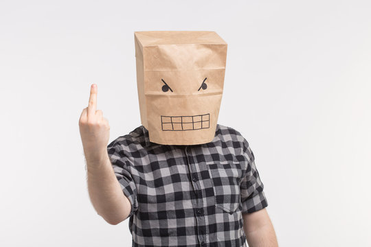 Fuck sign. Angry man with funny face showing fuck at camera.