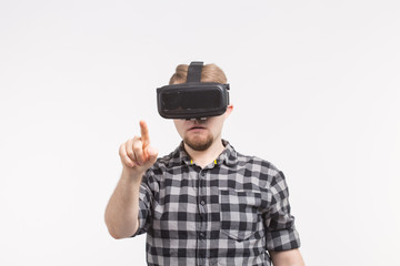 Man wearing virtual reality goggles on white background