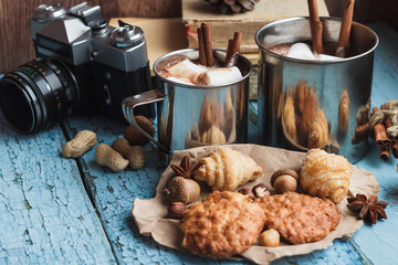 Metal mugs with cacao and marshmallows