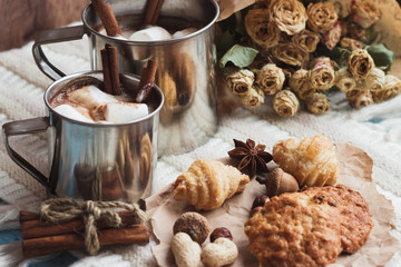 Metal mugs with cacao and marshmallows