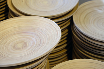 Brown wooden plates on the shelves close-up. Horizontal top view