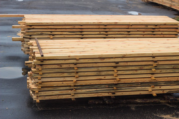 Piles of wooden boards in the sawmill, planking