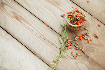 Goji fruits on wooden background
