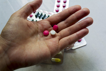 Pink  pills on the hand