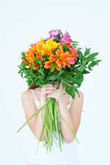 alstroemeria bouquet. spring and summer floral arranging. gift on birthday mothers day or anniversary present. girl holding a bunch of flowers