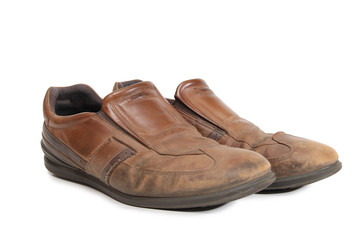 Old leather shoes on a white background