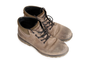 Old leather shoes on a white background