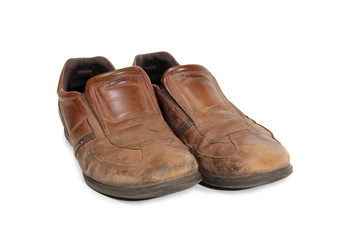 Old leather shoes on a white background