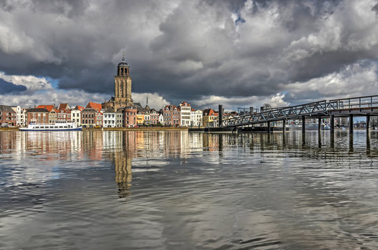 The city of Deventer, The Netherlands and its new ferry pier reflecting in the calm waters of the river IJssel