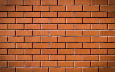 textured decorative orange brick wall. background, vignette, architecture.