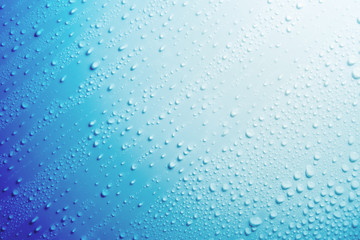 Water droplets on blue background.