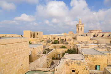 Victoria, the island of Gozo, Malta. Urban buildings inside the Citadel and the bell tower of the Cathedral