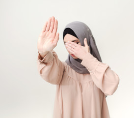 Muslim woman making stop gesture