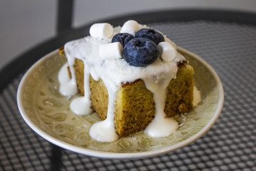 homemade honey carrot cake with blueberries and cream cheese