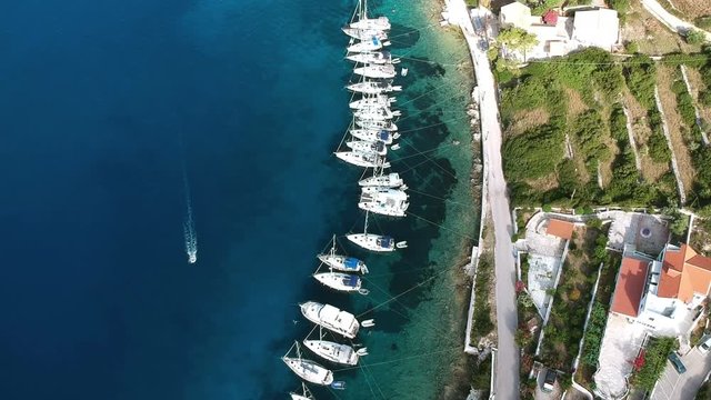 Aerial view of yachts and sailboats moored at the quay. Pier sailboats. 