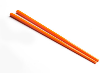Orange chopsticks isolated on white