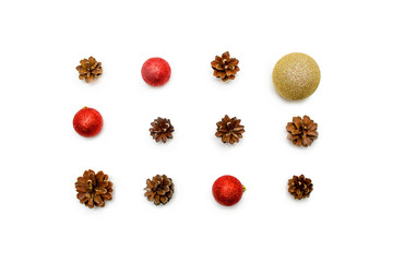 Christmas composition. pine cones, red and golden balls on white background. Flat lay, top view - holidays, winter and celebration concept -